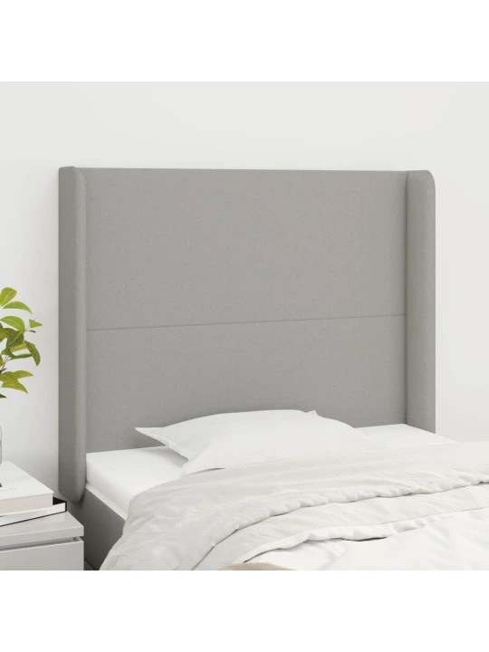 Čelo postele typu ušák světle šedé 103x16x118/128 cm textil