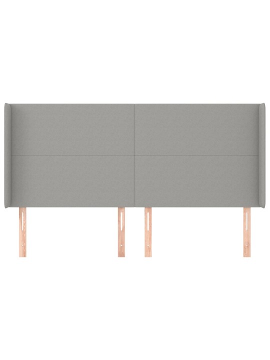 Čelo postele typu ušák světle šedé 163x16x118/128 cm textil