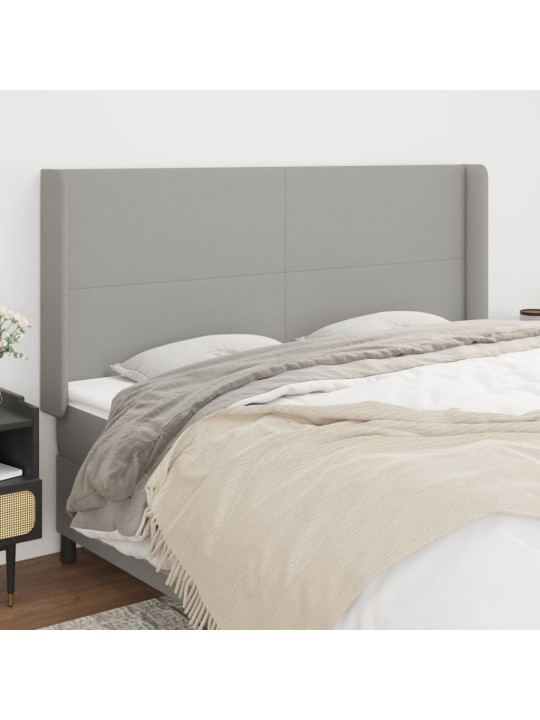 Čelo postele typu ušák světle šedé 203x16x118/128 cm textil