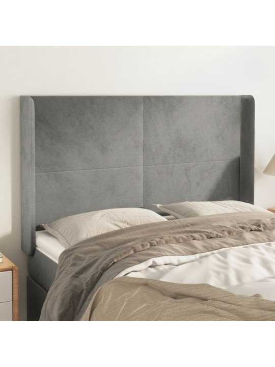 Čelo postele typu ušák světle šedé 147x16x118/128 cm samet