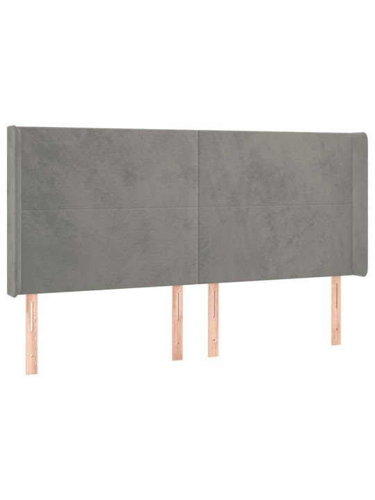 Čelo postele typu ušák světle šedé 163x16x118/128 cm samet