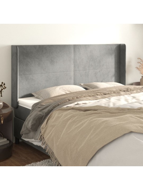Čelo postele typu ušák světle šedé 183x16x118/128 cm samet