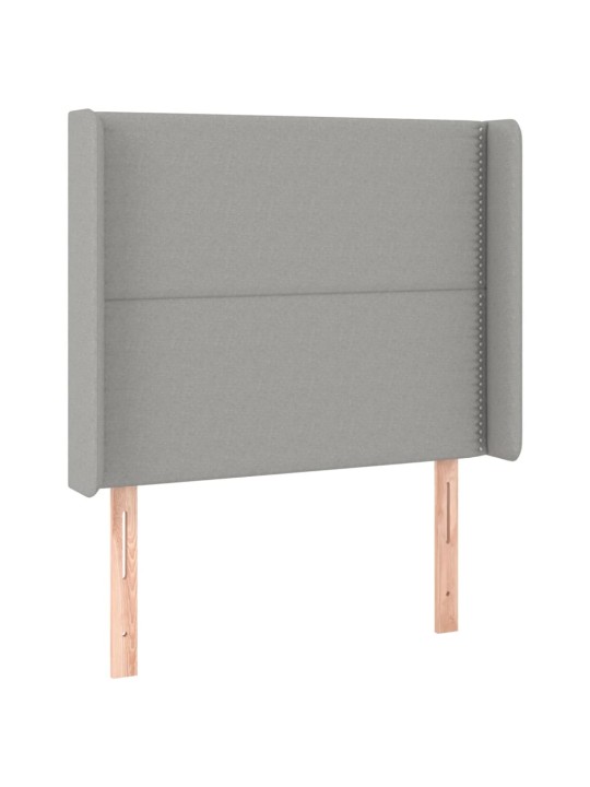 Čelo postele typu ušák světle šedé 83x16x118/128 cm textil