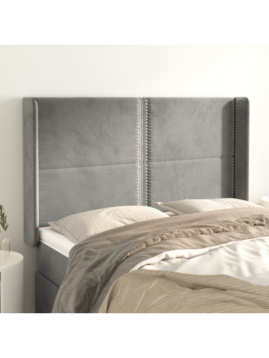 Čelo postele typu ušák světle šedé 147x16x118/128 cm samet
