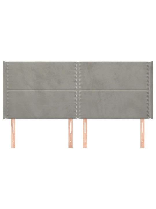 Čelo postele typu ušák světle šedé 163x16x118/128 cm samet