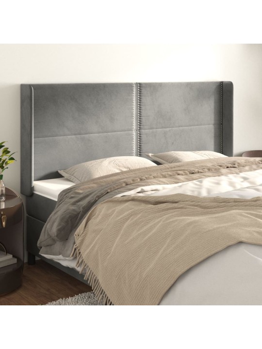 Čelo postele typu ušák světle šedé 203x16x118/128 cm samet