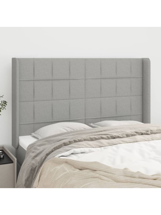 Čelo postele typu ušák světle šedé 147x16x118/128 cm textil