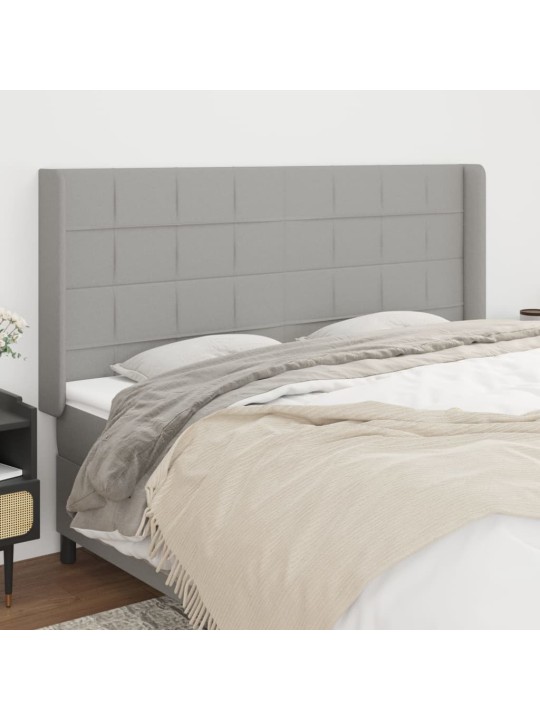 Čelo postele typu ušák světle šedé 203x16x118/128 cm textil