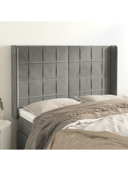 Čelo postele typu ušák světle šedé 147x16x118/128 cm samet