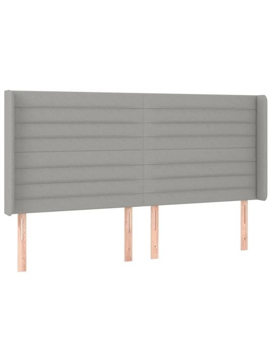 Čelo postele typu ušák světle šedé 183x16x118/128 cm textil