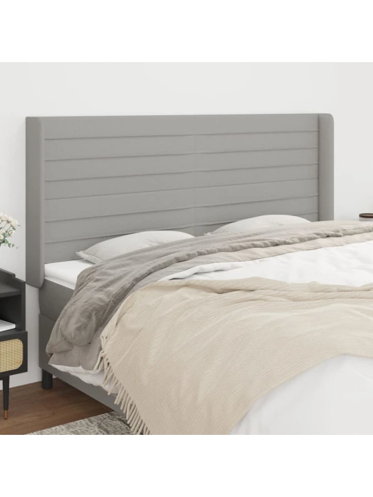 Čelo postele typu ušák světle šedé 183x16x118/128 cm textil
