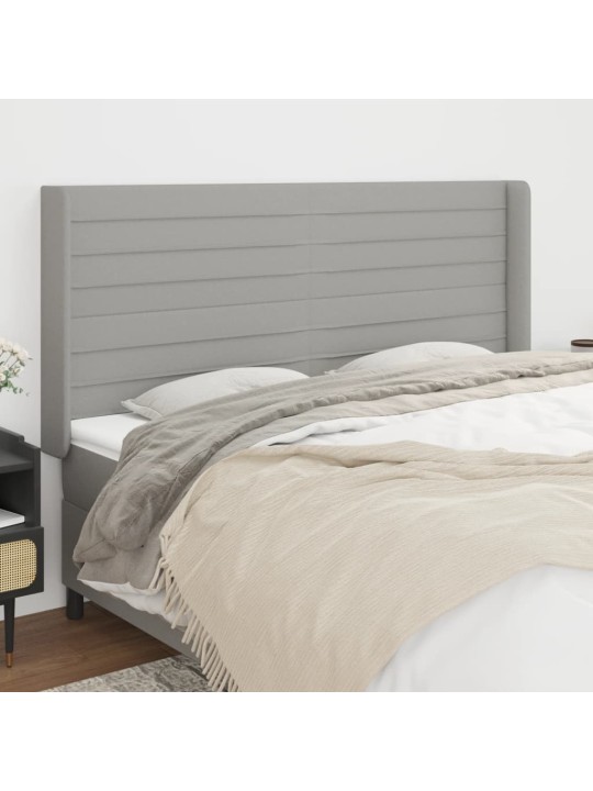 Čelo postele typu ušák světle šedé 203x16x118/128 cm textil