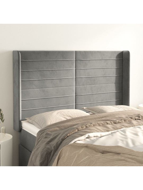 Čelo postele typu ušák světle šedé 147x16x118/128 cm samet