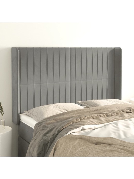 Čelo postele typu ušák světle šedé 147x16x118/128 cm samet