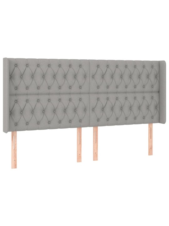 Čelo postele typu ušák světle šedé 183x16x118/128 cm textil