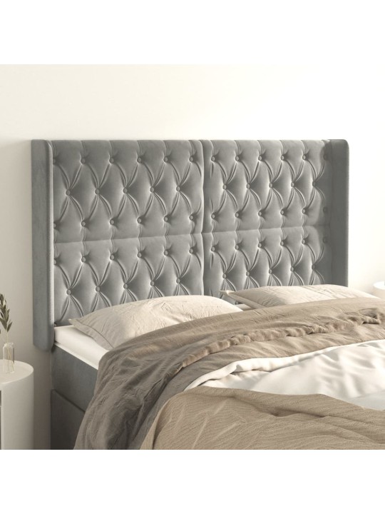 Čelo postele typu ušák světle šedé 147x16x118/128 cm samet