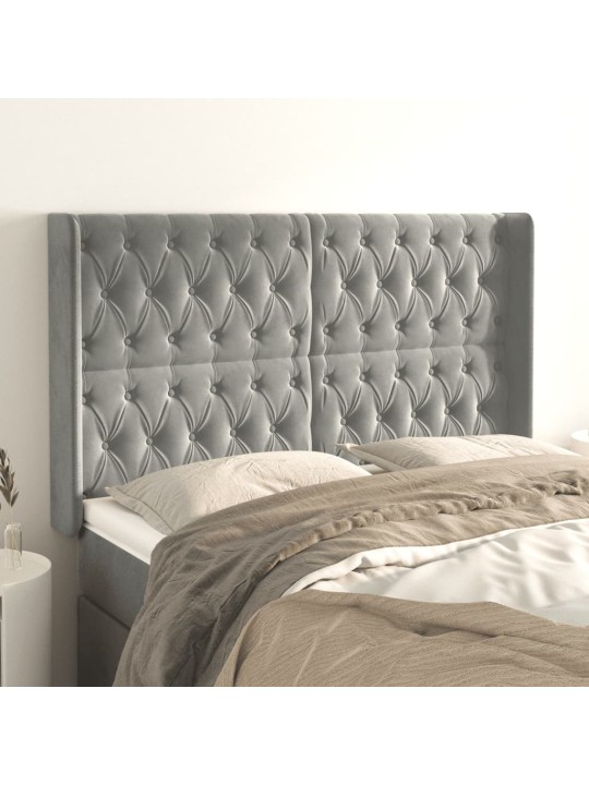 Čelo postele typu ušák světle šedé 163x16x118/128 cm samet