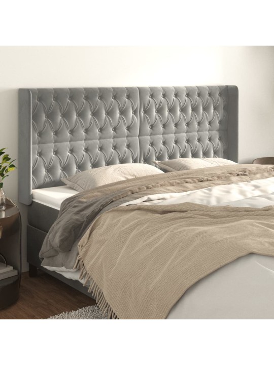 Čelo postele typu ušák světle šedé 183x16x118/128 cm samet
