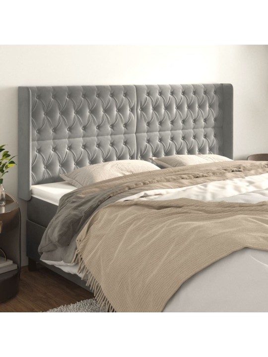 Čelo postele typu ušák světle šedé 203x16x118/128 cm samet