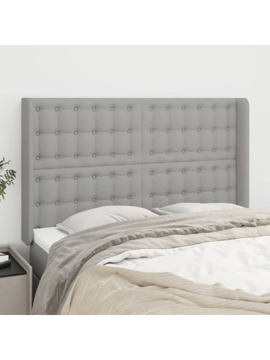 Čelo postele typu ušák světle šedé 147x16x118/128 cm textil