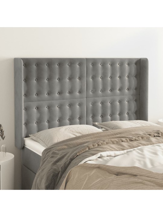 Čelo postele typu ušák světle šedé 147x16x118/128 cm samet