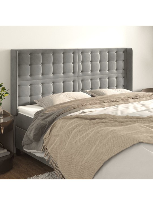 Čelo postele typu ušák světle šedé 203x16x118/128 cm samet
