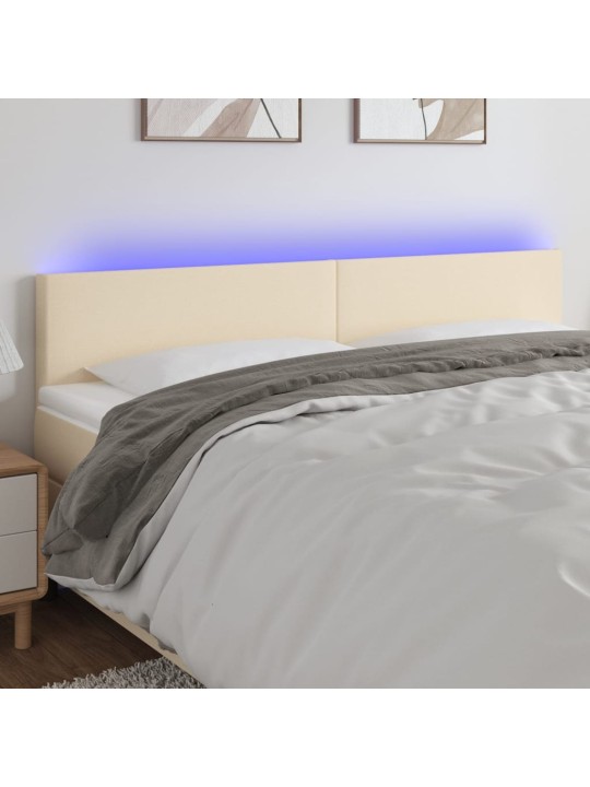 Čelo postele s LED krémové 160x5x78/88 cm textil