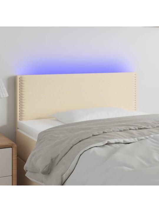 Čelo postele s LED krémové 80 x 5 x 78/88 cm textil