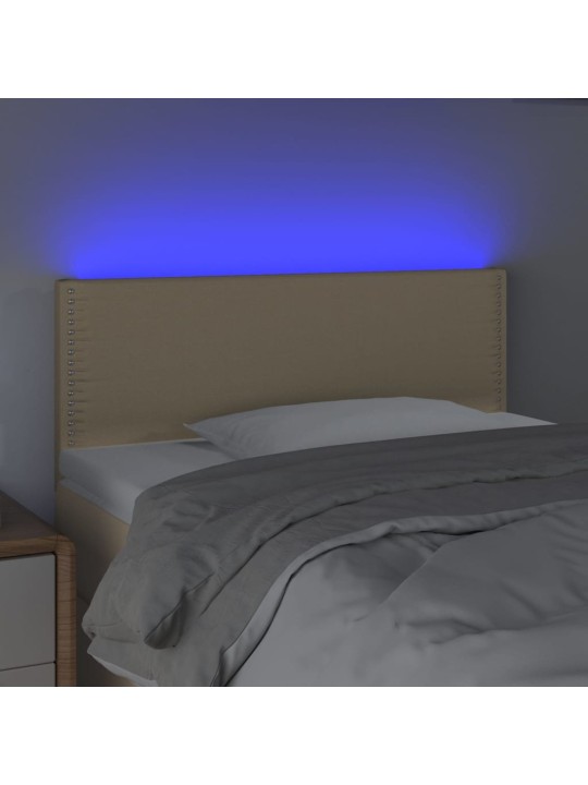 Čelo postele s LED krémové 100x5x78/88 cm textil
