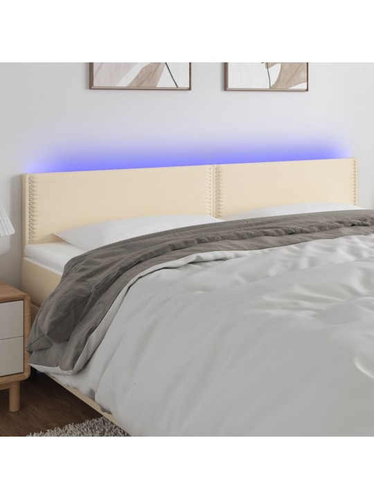 Čelo postele s LED krémové 160x5x78/88 cm textil