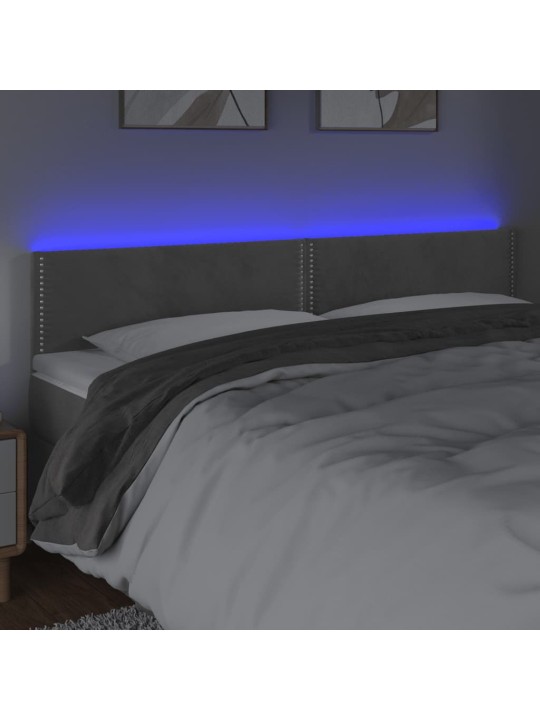 Čelo postele s LED světle šedé 160x5x78/88 cm samet