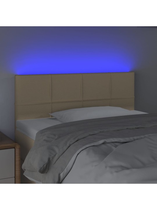 Čelo postele s LED krémové 100x5x78/88 cm textil