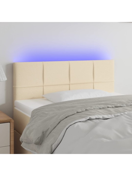 Čelo postele s LED krémové 100x5x78/88 cm textil