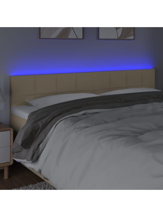 Čelo postele s led krémové 160x5x78/88 cm textil