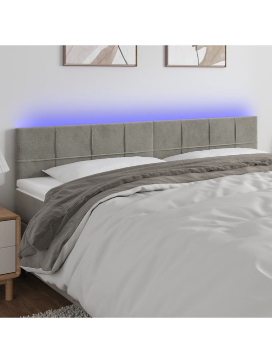 Čelo postele s LED světle šedé 160x5x78/88 cm samet