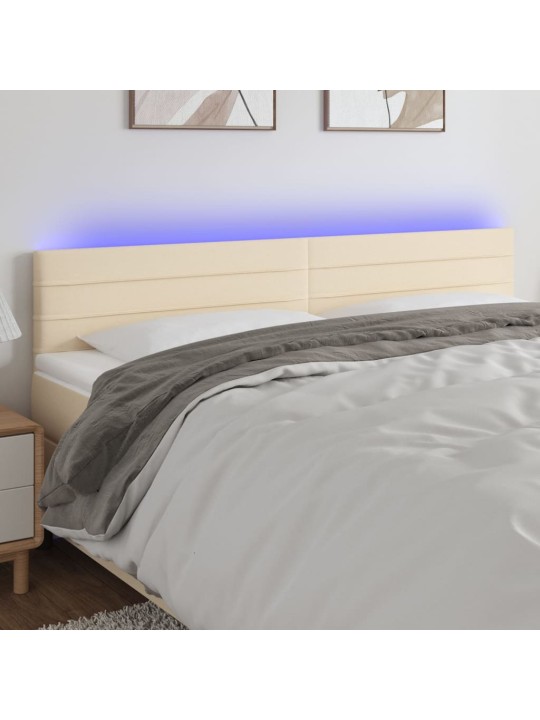 Čelo postele s LED krémové 160x5x78/88 cm textil
