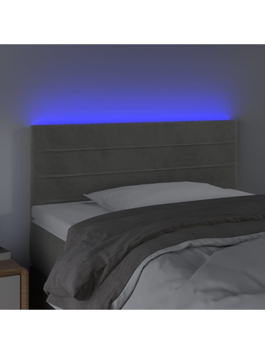 Čelo postele s LED světle šedé 90x5x78/88 cm samet