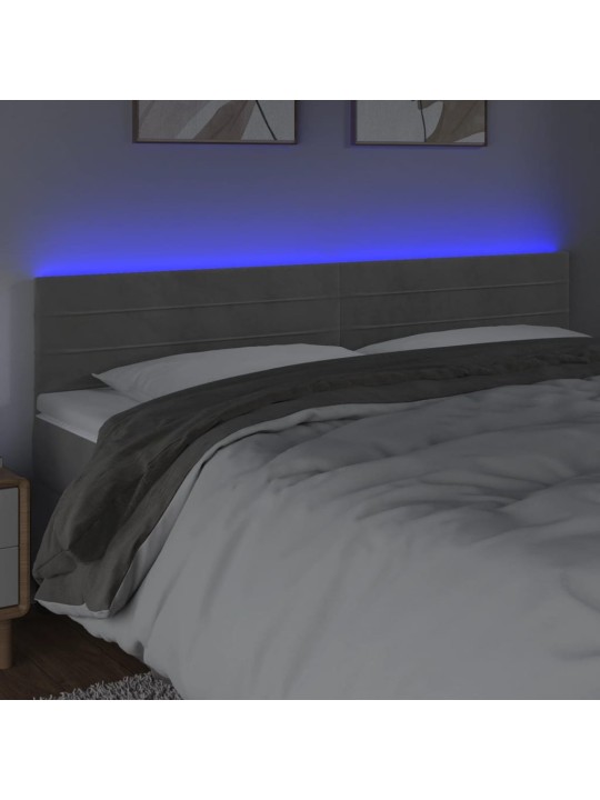 Čelo postele s LED světle šedé 160x5x78/88 cm samet