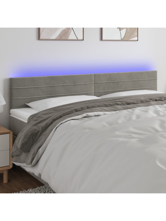 Čelo postele s LED světle šedé 160x5x78/88 cm samet