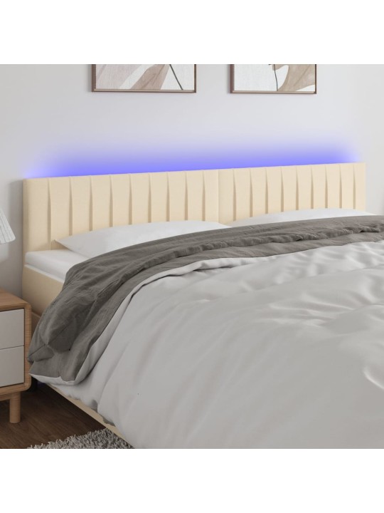 Čelo postele s LED krémové 160x5x78/88 cm textil