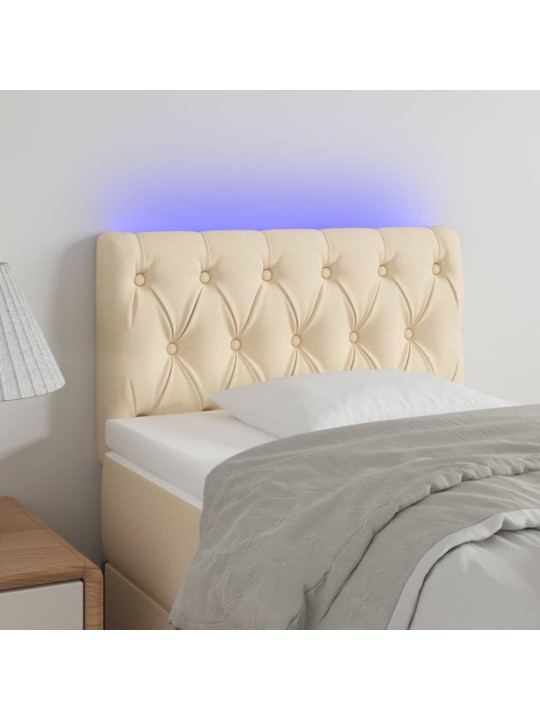 Čelo postele s led krémové 80 x 7 x 78/88 cm textil
