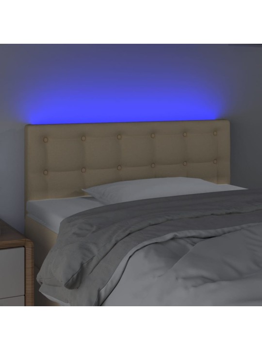 Čelo postele s LED krémové 100x5x78/88 cm textil