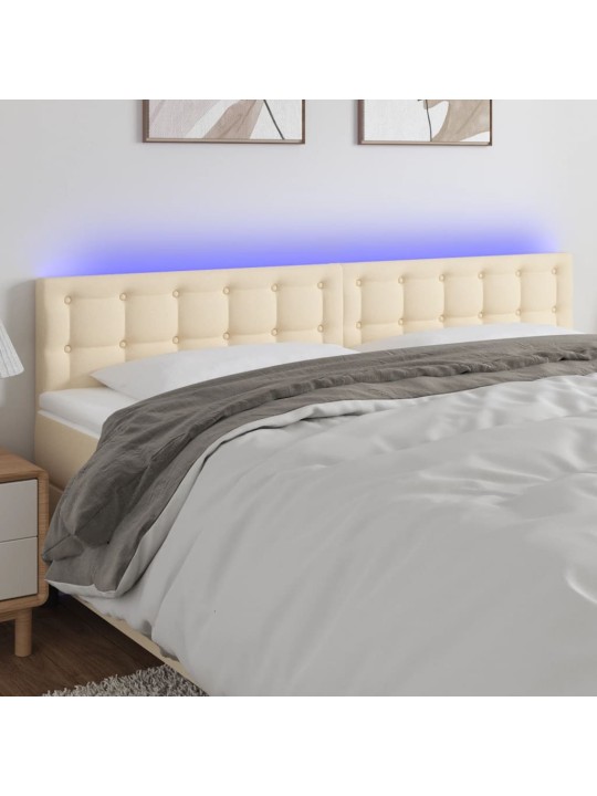 Čelo postele s led krémové 160x5x78/88 cm textil