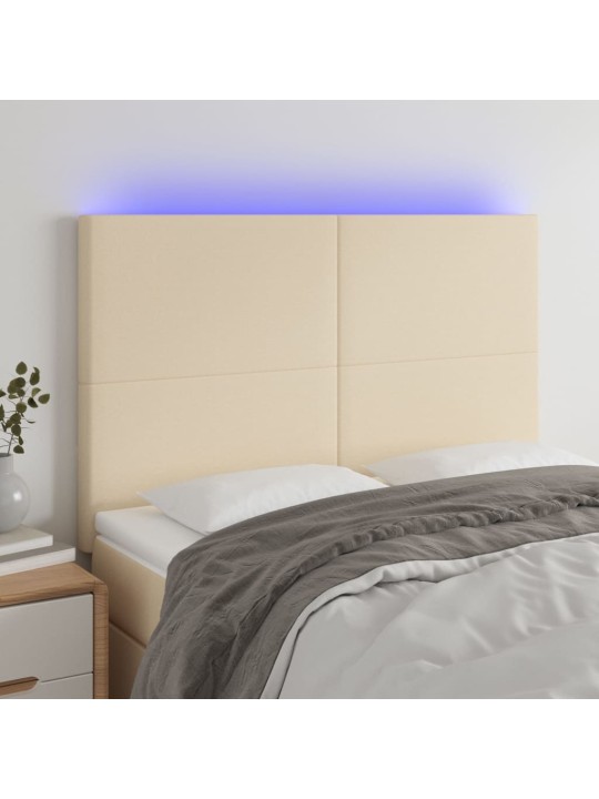 Čelo postele s led krémové 144x5x118/128 cm textil