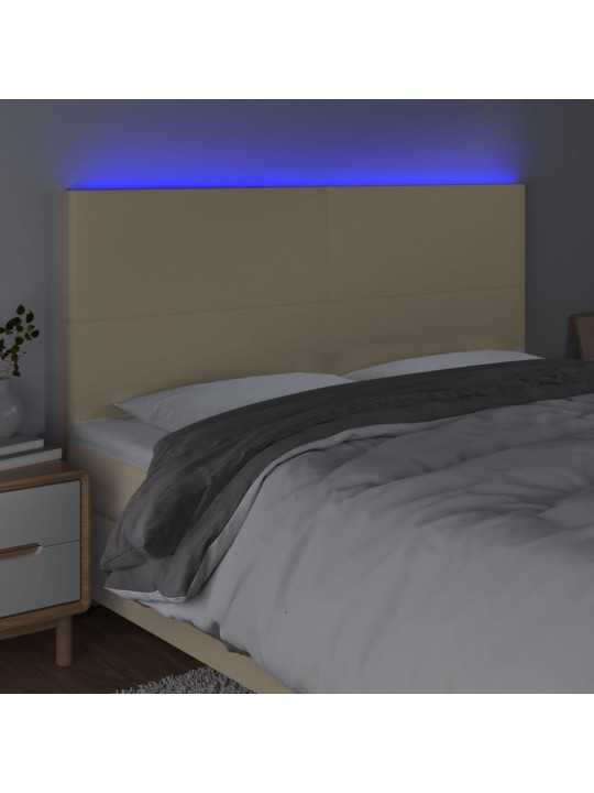 Čelo postele s led krémové 160x5x118/128 cm textil