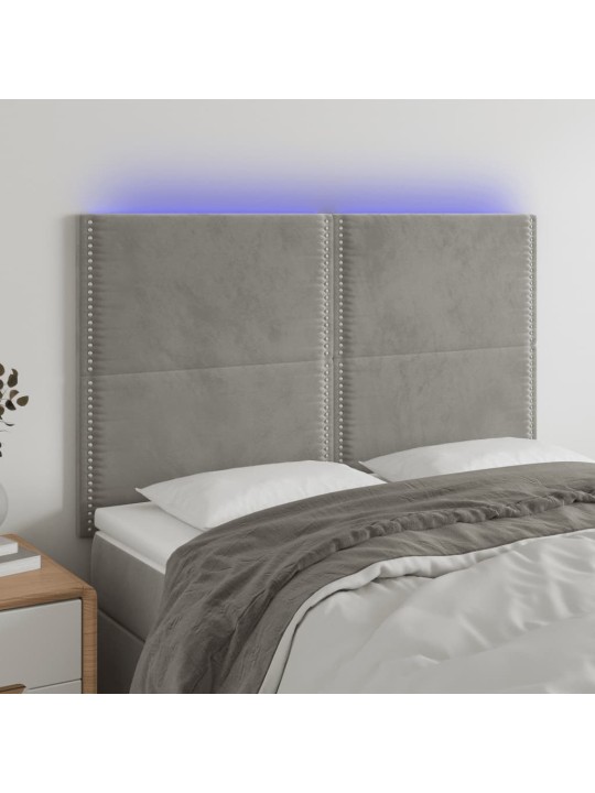 Čelo postele s LED světle šedé 144x5x118/128 cm samet