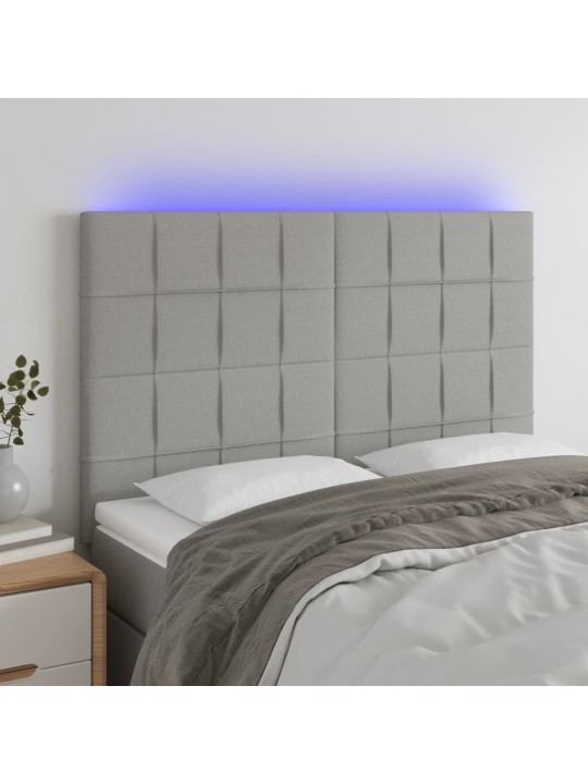 Čelo postele s LED světle šedé 144x5x118/128 cm textil