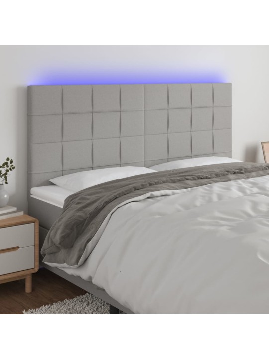 Čelo postele s LED světle šedé 160x5x118/128 cm textil