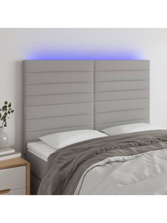 Čelo postele s LED světle šedé 144x5x118/128 cm textil