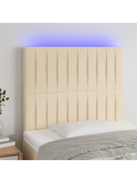 Čelo postele s LED krémové 100x5x118/128 cm textil
